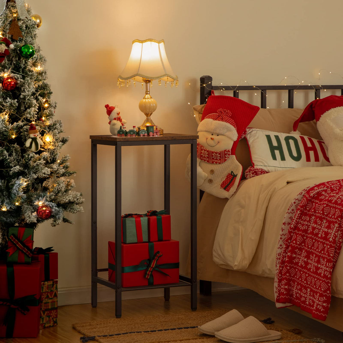 Decorated bedroom with Christmas tree, presents, and festive decor.