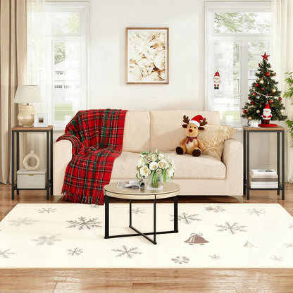 Living room with a Christmas theme, including a tree, decorations, and a plaid blanket.