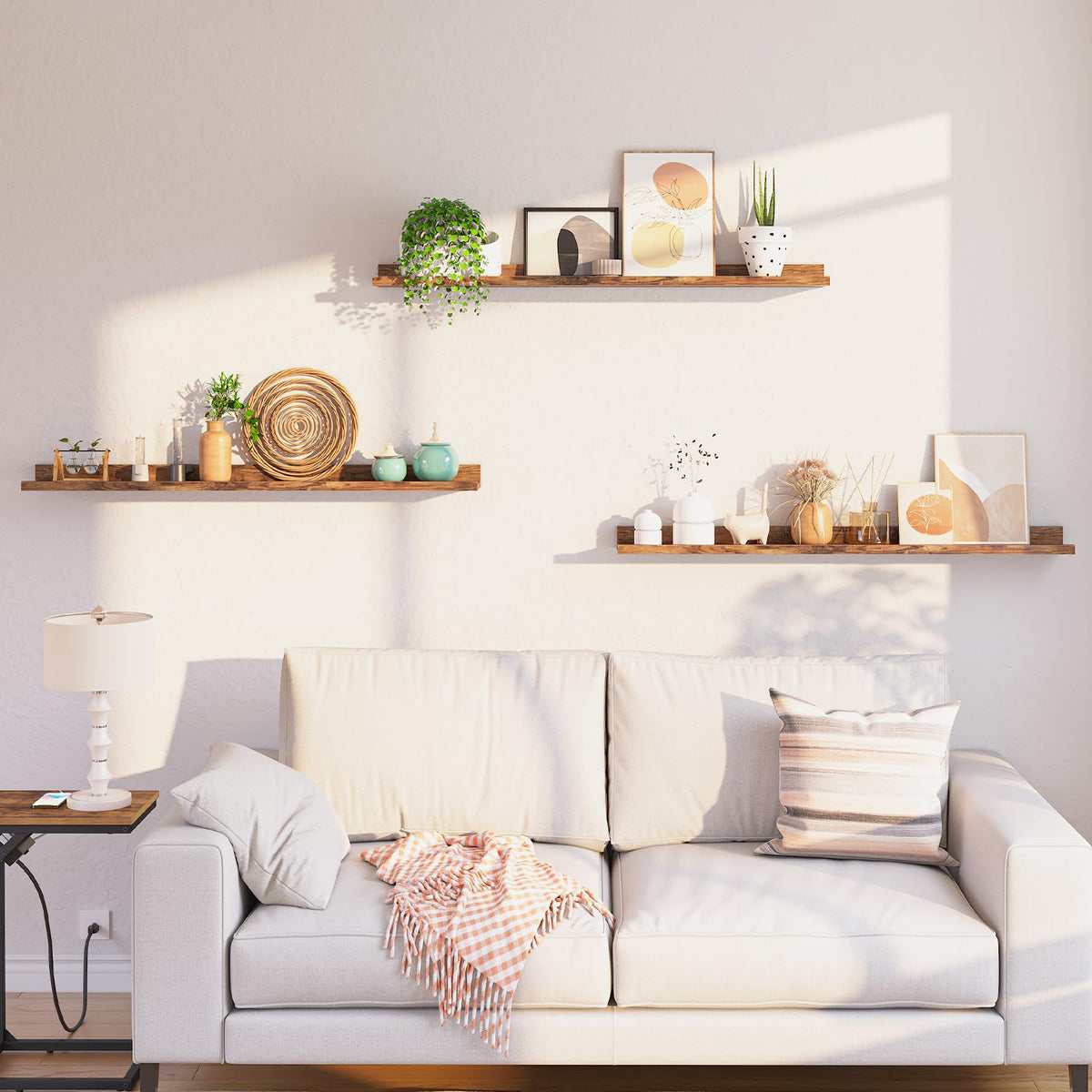 Living room with a white sofa, decorative pillows, and shelves with plants and decor.