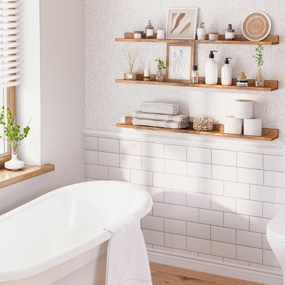 Bathroom with wooden shelves, white bathtub, and decorative items.